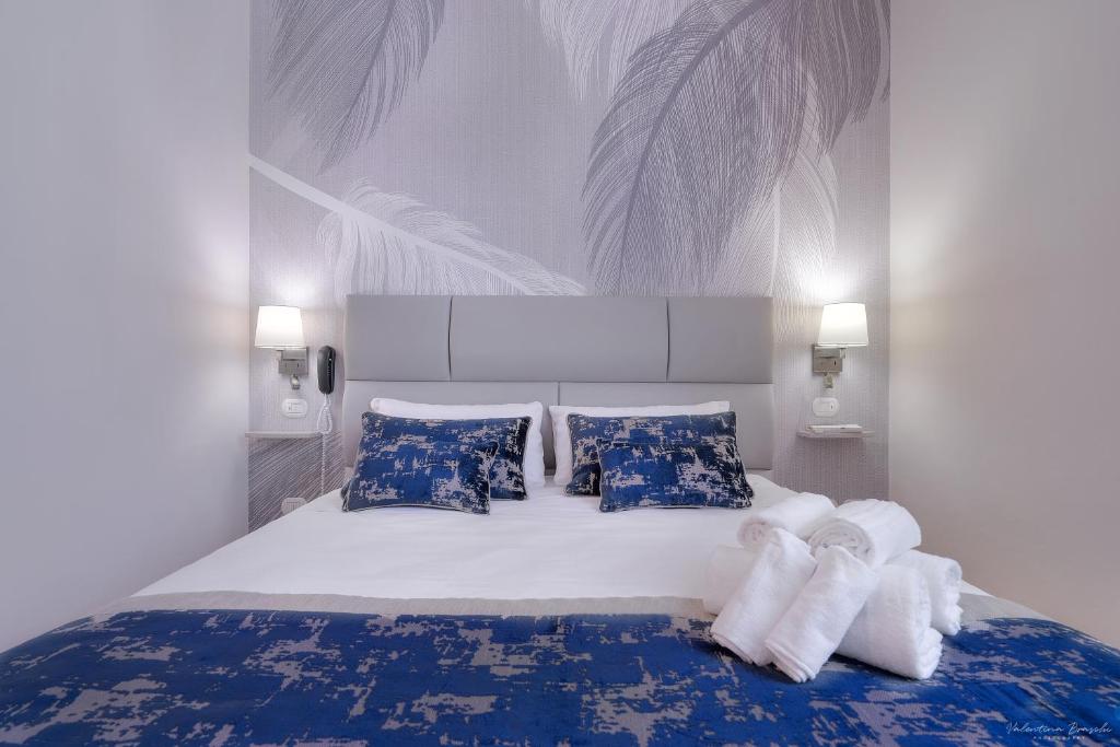 Postel nebo postele na pokoji v ubytování Hotel Cosmos