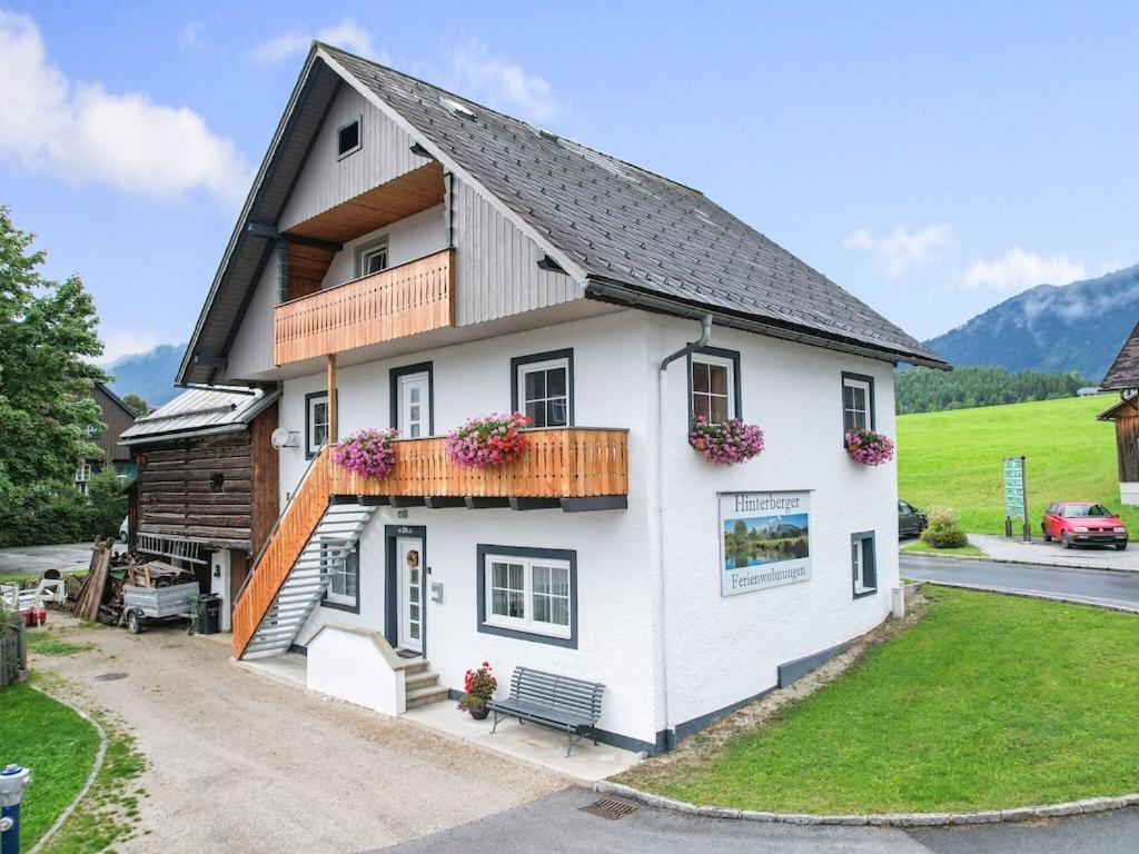 a white house with a black roof at Apartment in Bad Mitterndorf near ski area in Bad Mitterndorf
