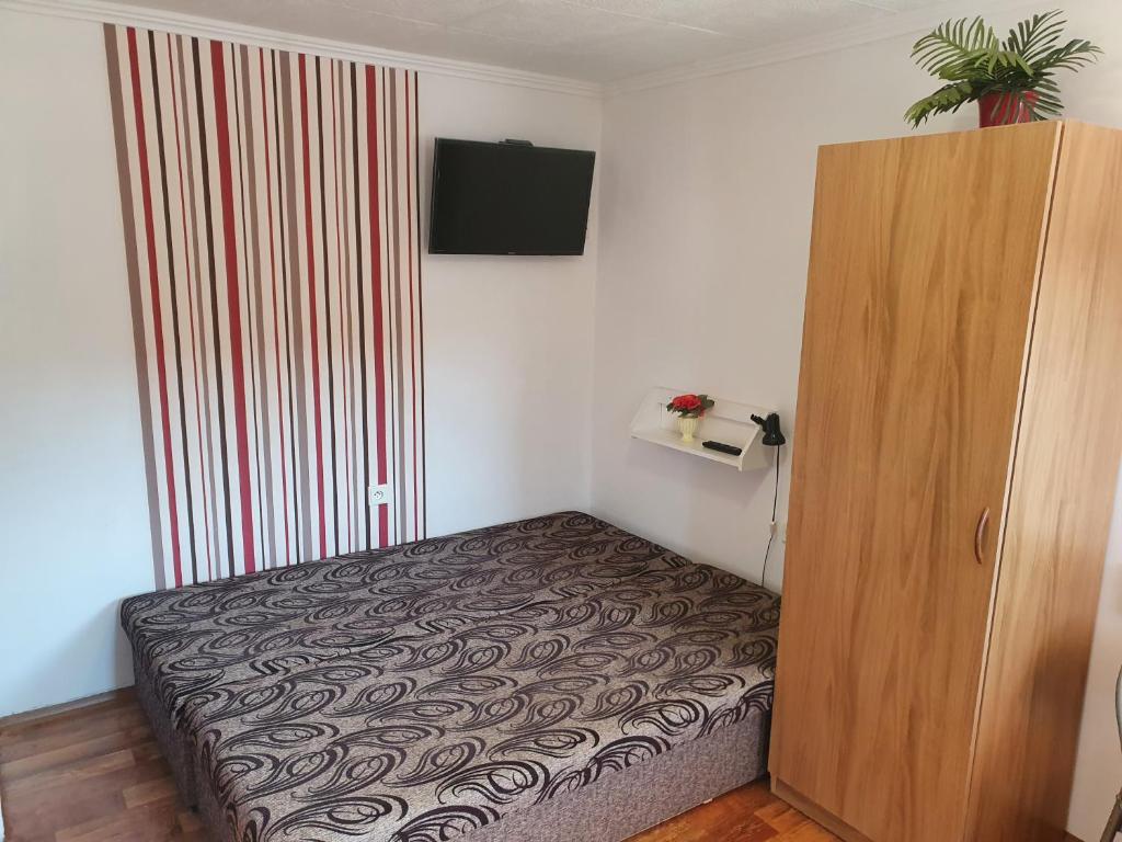 A bed or beds in a room at Privat u Jozefa Földesa