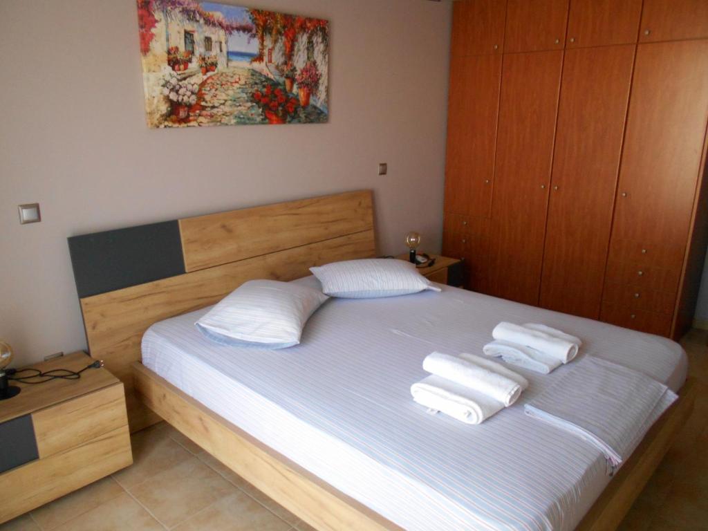 Postel nebo postele na pokoji v ubytování SPΛCES PYLOS Apartments