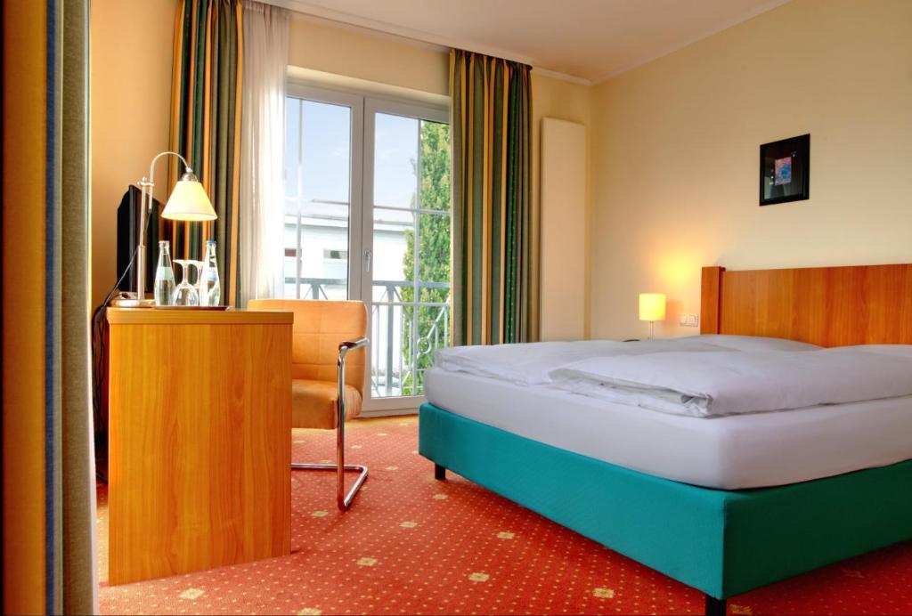 Postel nebo postele na pokoji v ubytování Hotel Zielonka