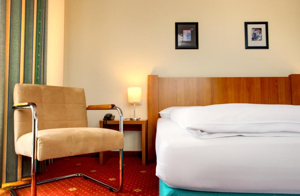Postel nebo postele na pokoji v ubytování Hotel Zielonka