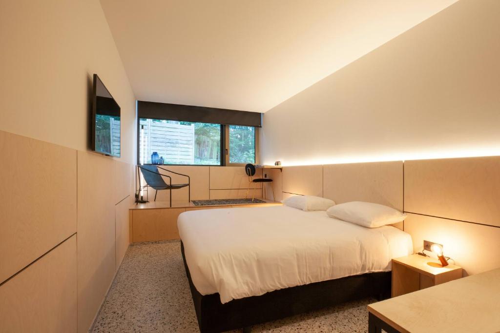 Ένα ή περισσότερα κρεβάτια σε δωμάτιο στο Hotel The Lodge Heverlee