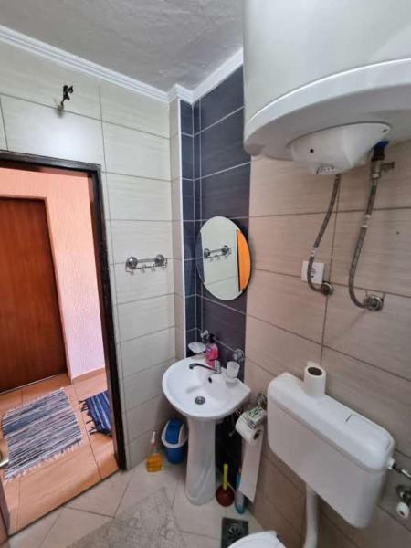 a bathroom with a sink and a toilet and a shower at Дом для семейного отдыха в Утехе, Черногория in Utjeha