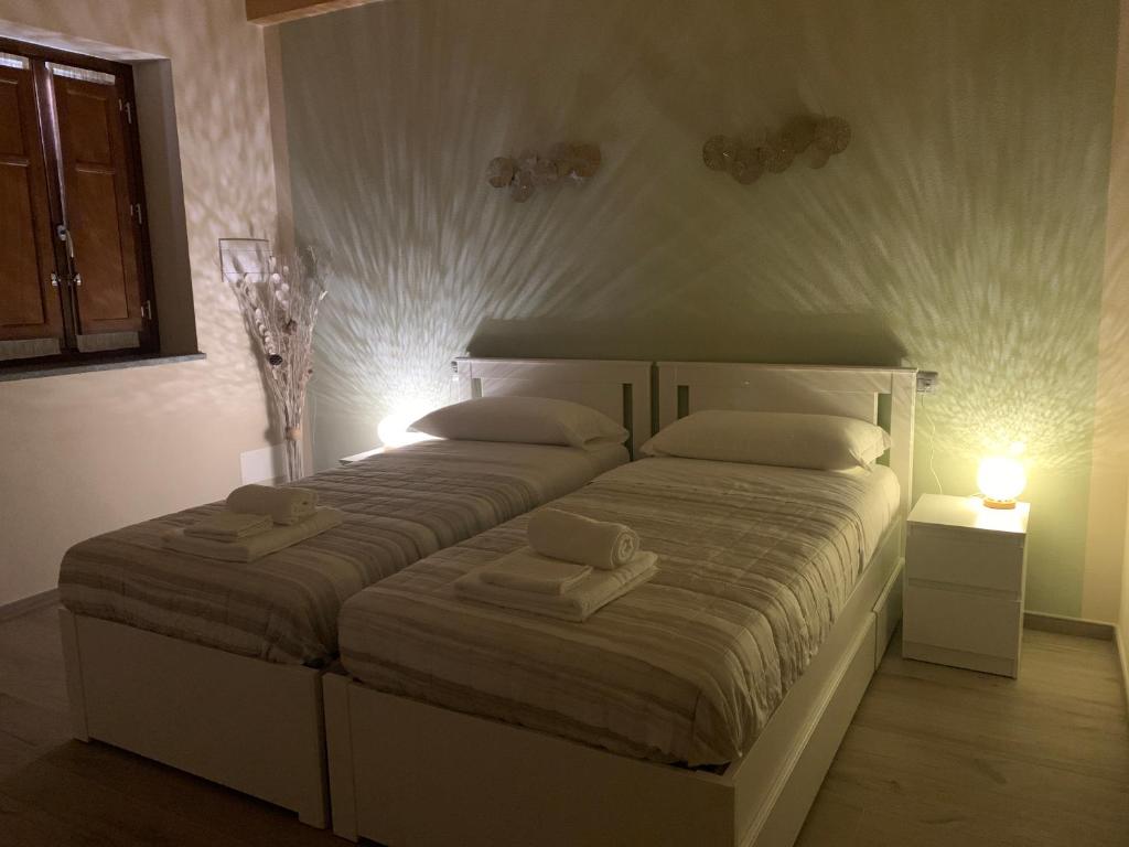 Posteľ alebo postele v izbe v ubytovaní B&B La Luce Verde