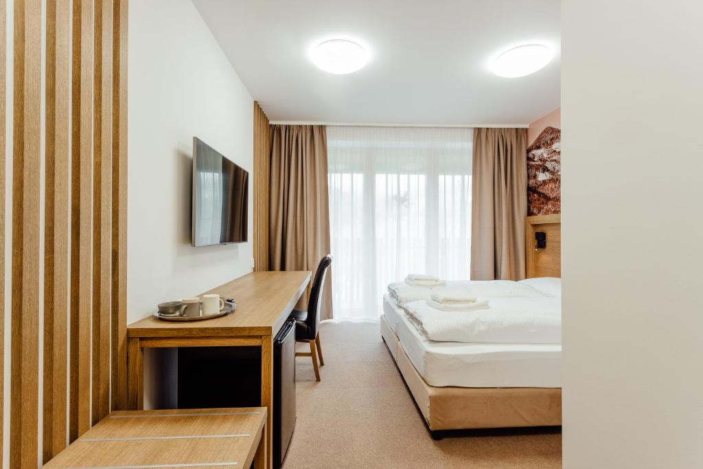 TV a/nebo společenská místnost v ubytování Apartmány Humno