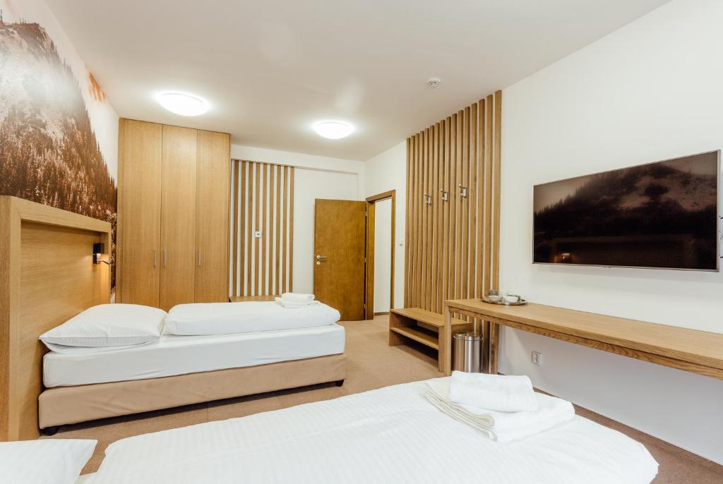 Postel nebo postele na pokoji v ubytování Apartmány Humno