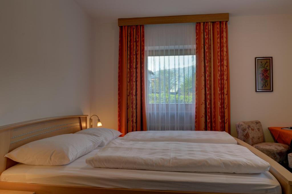 Postel nebo postele na pokoji v ubytování Garni Kofler