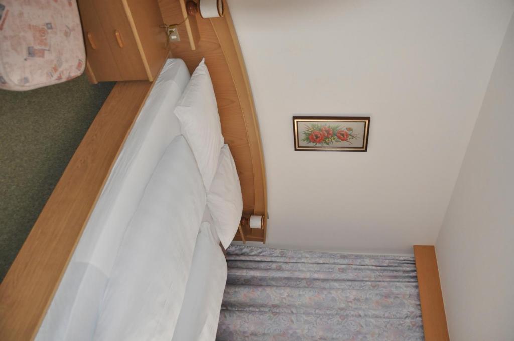 Postel nebo postele na pokoji v ubytování Garni Kofler