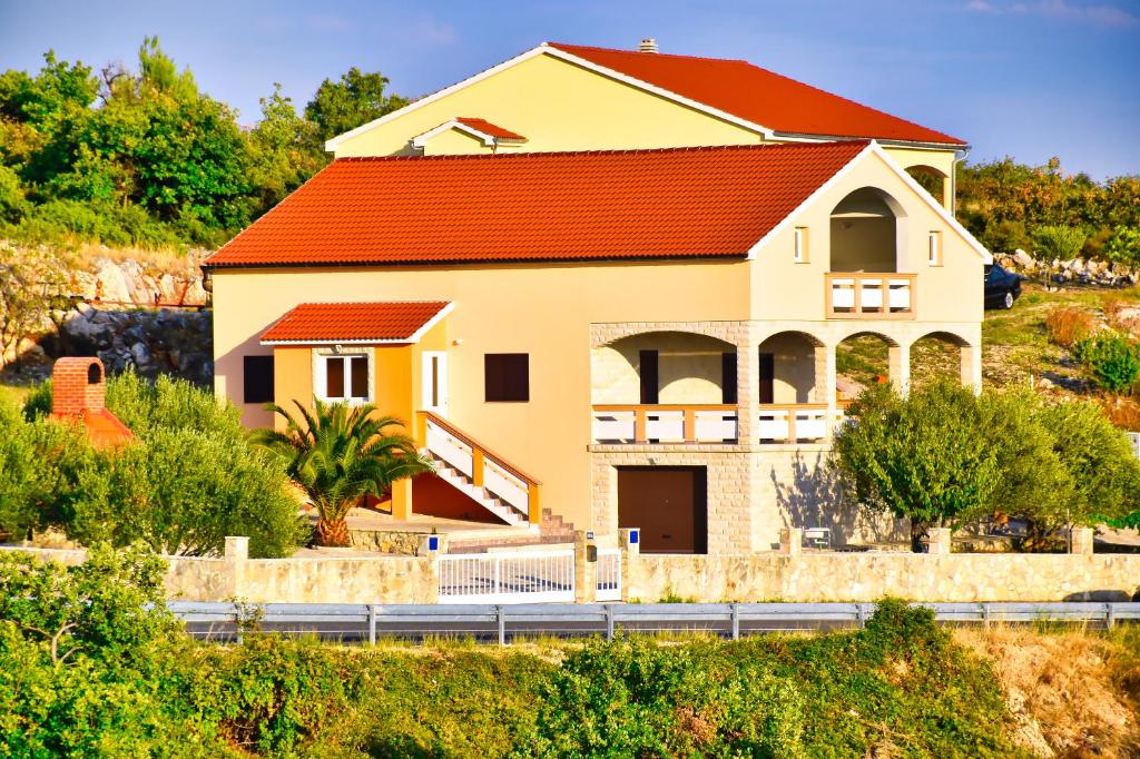 a house with an orange roof at Apartman ZORKA in Radovin