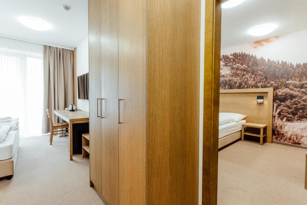 Postel nebo postele na pokoji v ubytování Apartmány Humno