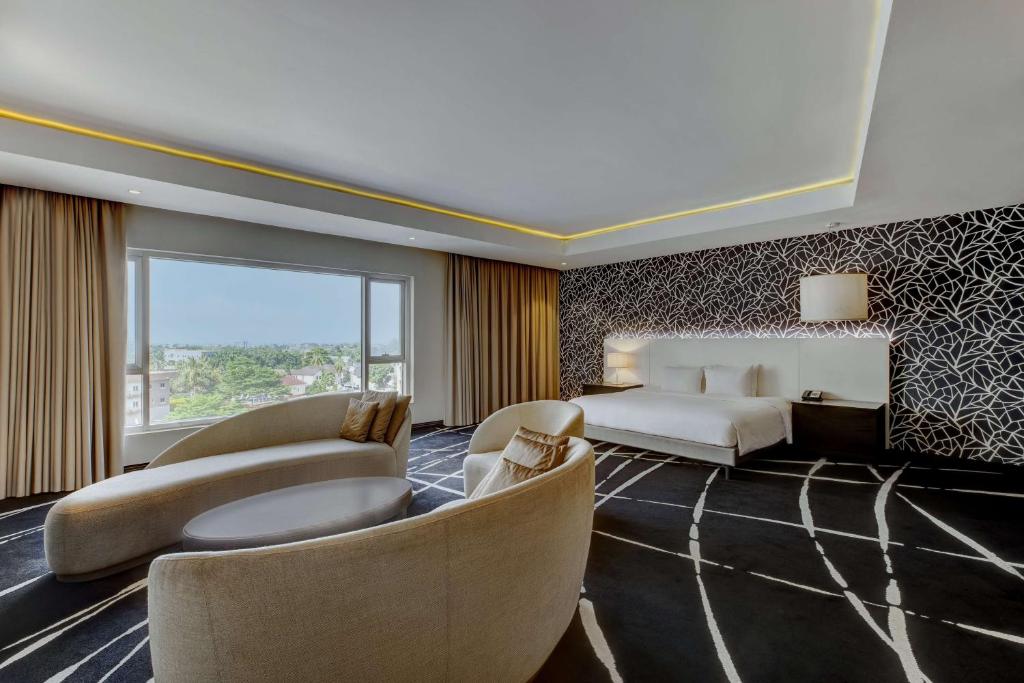 Ένα ή περισσότερα κρεβάτια σε δωμάτιο στο Radisson Blu Lagos Ikeja