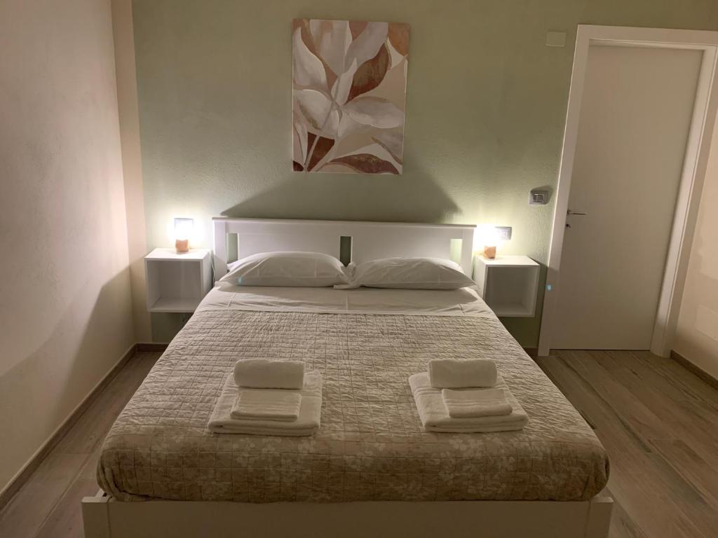 Posteľ alebo postele v izbe v ubytovaní B&B La Luce Verde
