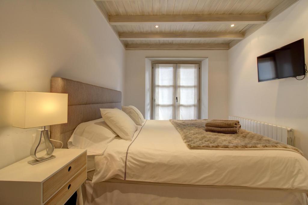 A bed or beds in a room at Varrados by Totiaran