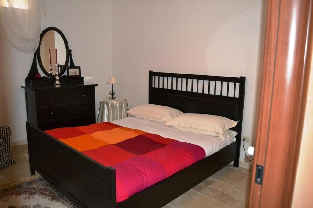 Postel nebo postele na pokoji v ubytování La Vigna Vecchia