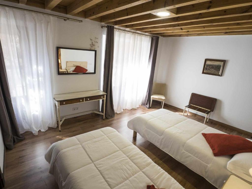 Postel nebo postele na pokoji v ubytování Posada Casa Juanes