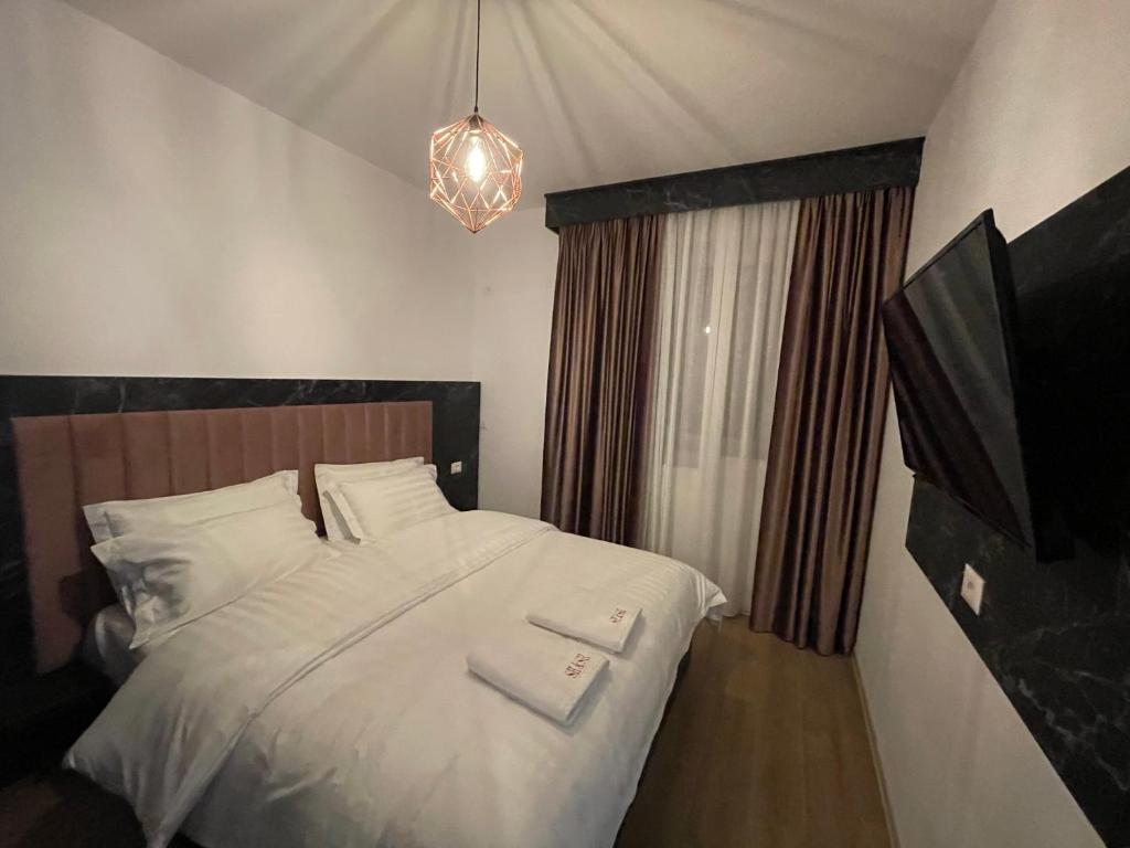 Letto o letti in una camera di Hotel SH & SH