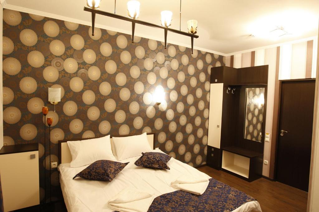 Postel nebo postele na pokoji v ubytování IRIS Hotel