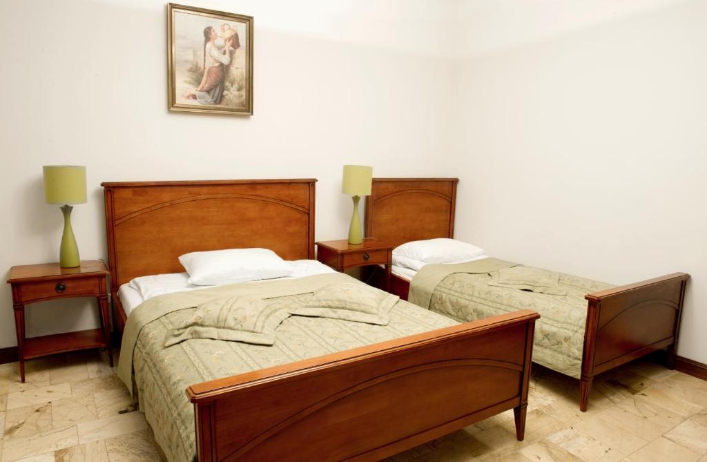 Postel nebo postele na pokoji v ubytování Zamek Na Skale