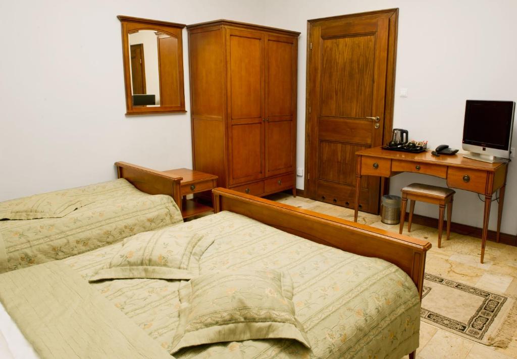 Postel nebo postele na pokoji v ubytování Zamek Na Skale