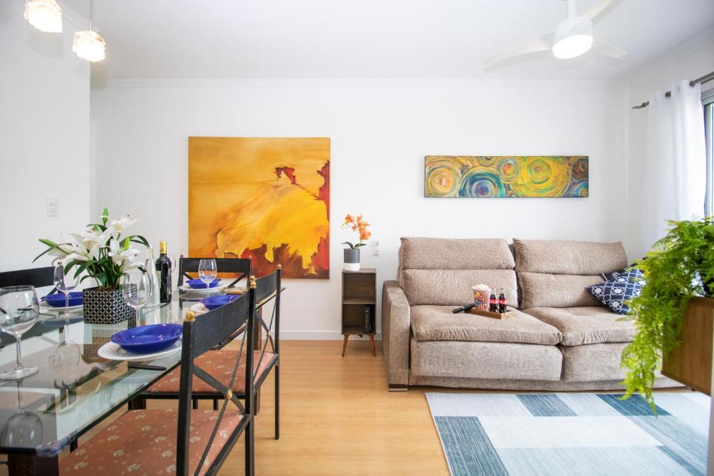 a living room with a couch and a glass table at 3 Quartos, espaçoso, Shopping Raposo in Sao Paulo