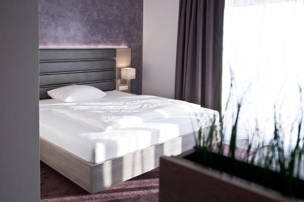 Postel nebo postele na pokoji v ubytování Hotel Rieth