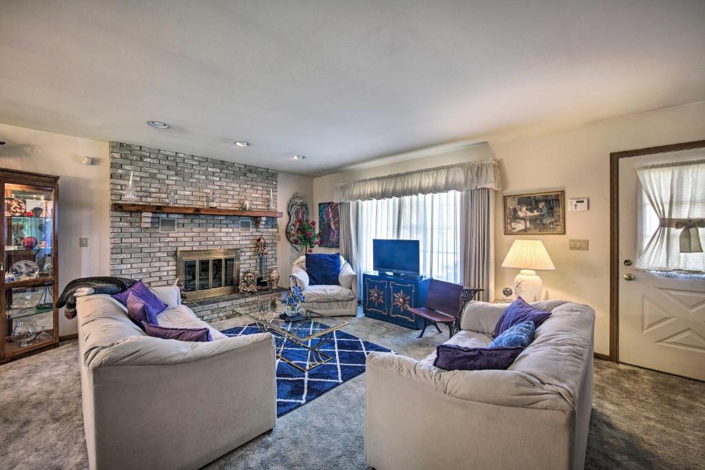 a living room with two couches and a fireplace at Harrisburg Home with Deck 12 Mi to Hersheypark in Harrisburg