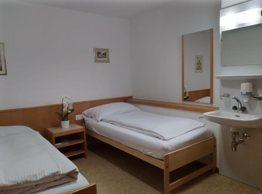 Ein Bett oder Betten in einem Zimmer der Unterkunft Albergo Faido