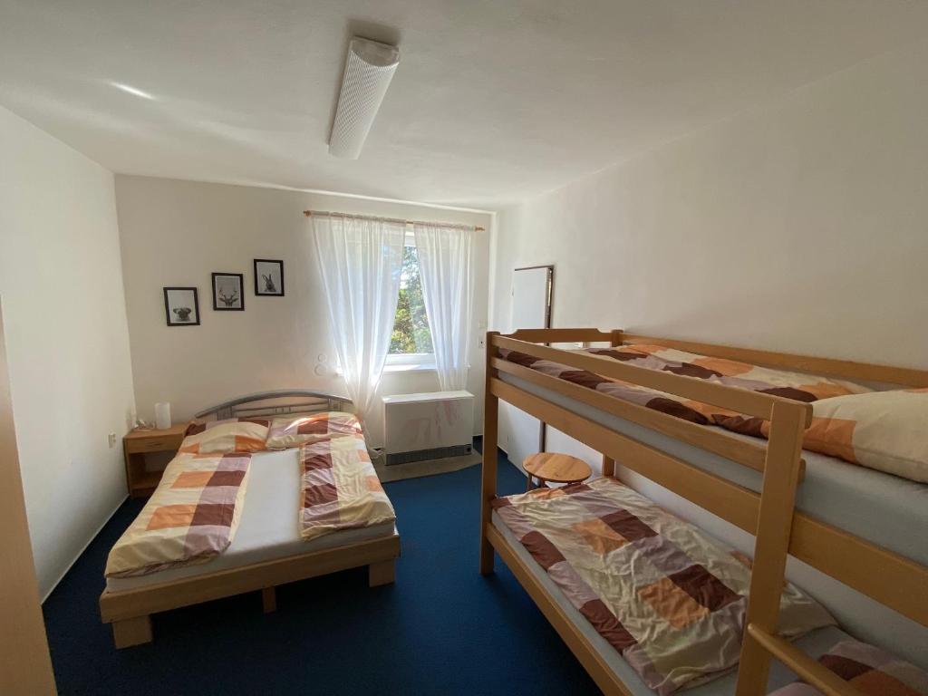 Postel nebo postele na pokoji v ubytování Chata Svinec