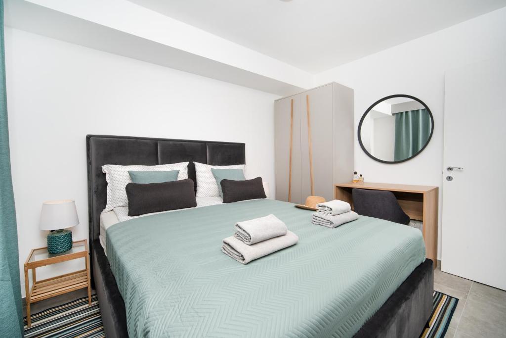 Postel nebo postele na pokoji v ubytování Apartments Palma Rabac
