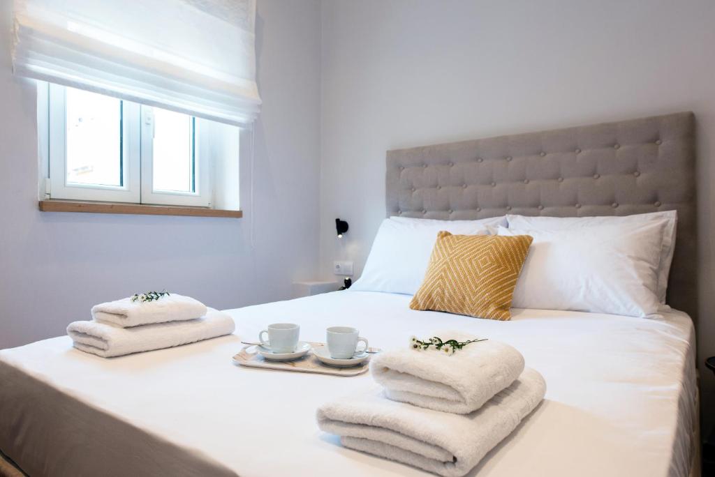 A bed or beds in a room at Arieni Sea View House