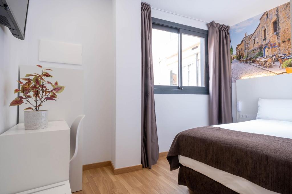 Posteľ alebo postele v izbe v ubytovaní Hotel BESTPRICE Girona