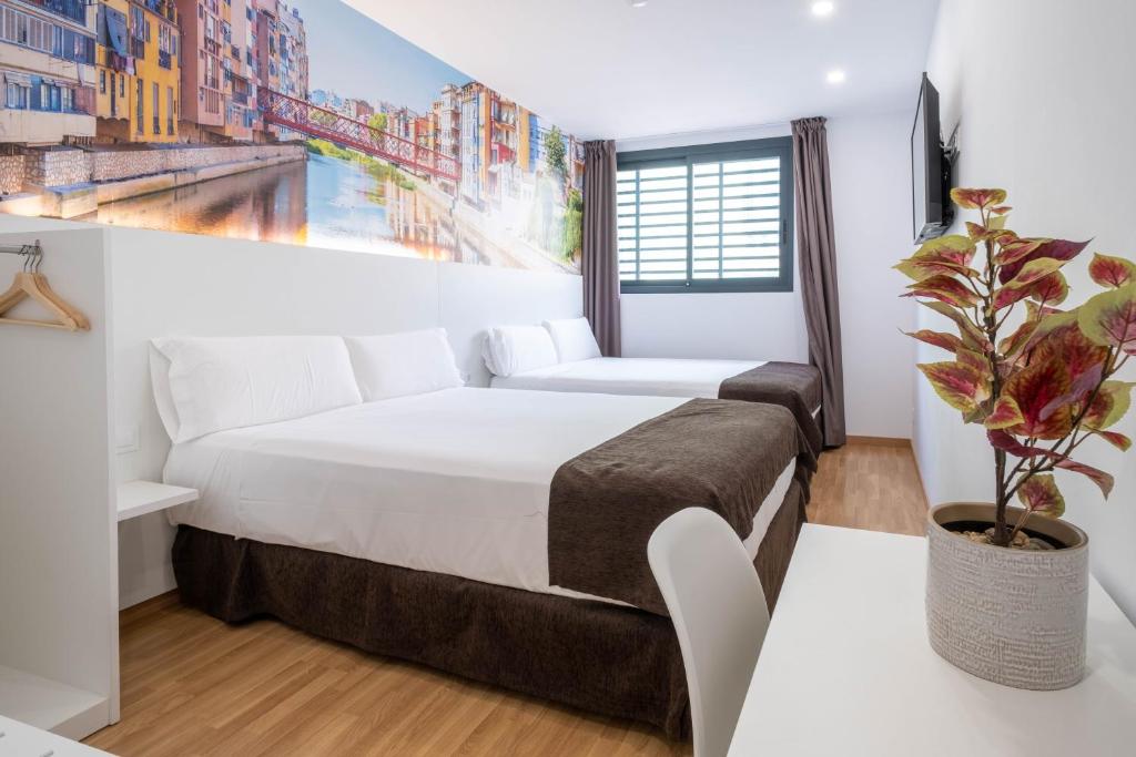 Posteľ alebo postele v izbe v ubytovaní Hotel BESTPRICE Girona