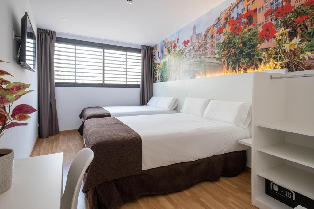 Posteľ alebo postele v izbe v ubytovaní Hotel BESTPRICE Girona