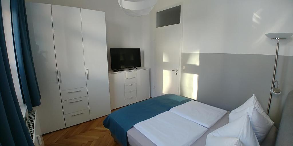 Postel nebo postele na pokoji v ubytování attraktives 2-Zimmer-Apartment im Stadtzentrum