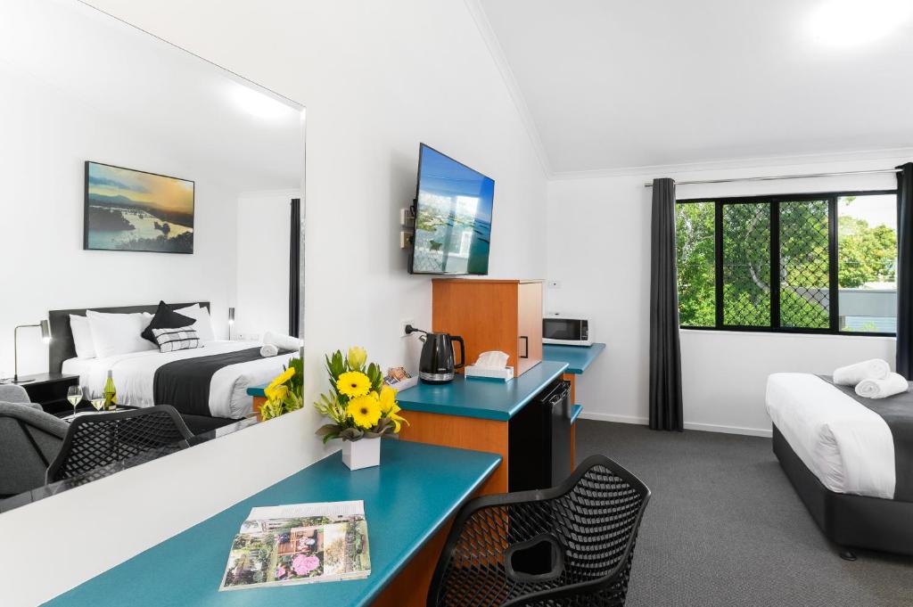 Postel nebo postele na pokoji v ubytování CQ Motel Gladstone