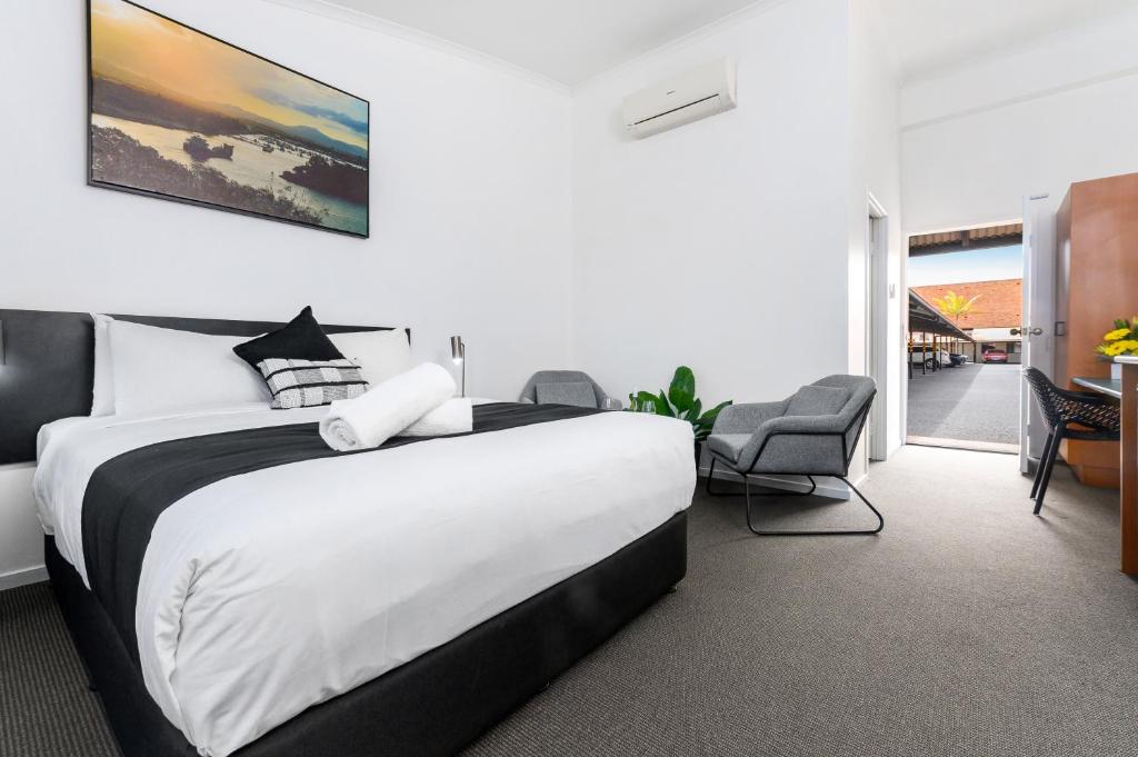 Postel nebo postele na pokoji v ubytování CQ Motel Gladstone
