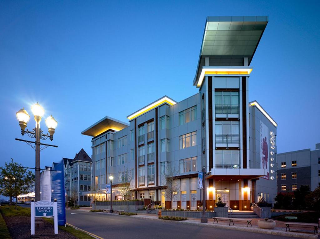 a building with a street light in front of it at Bungalow Hotel in Long Branch