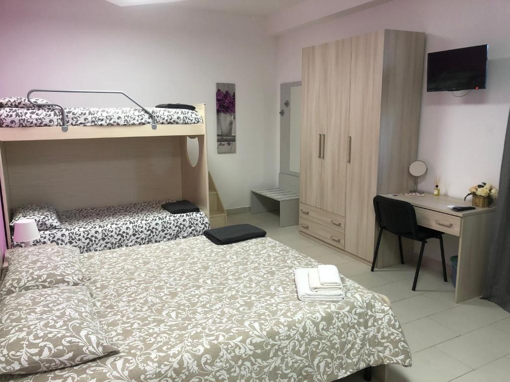 Postel nebo postele na pokoji v ubytování B&B La Casa di Violetta
