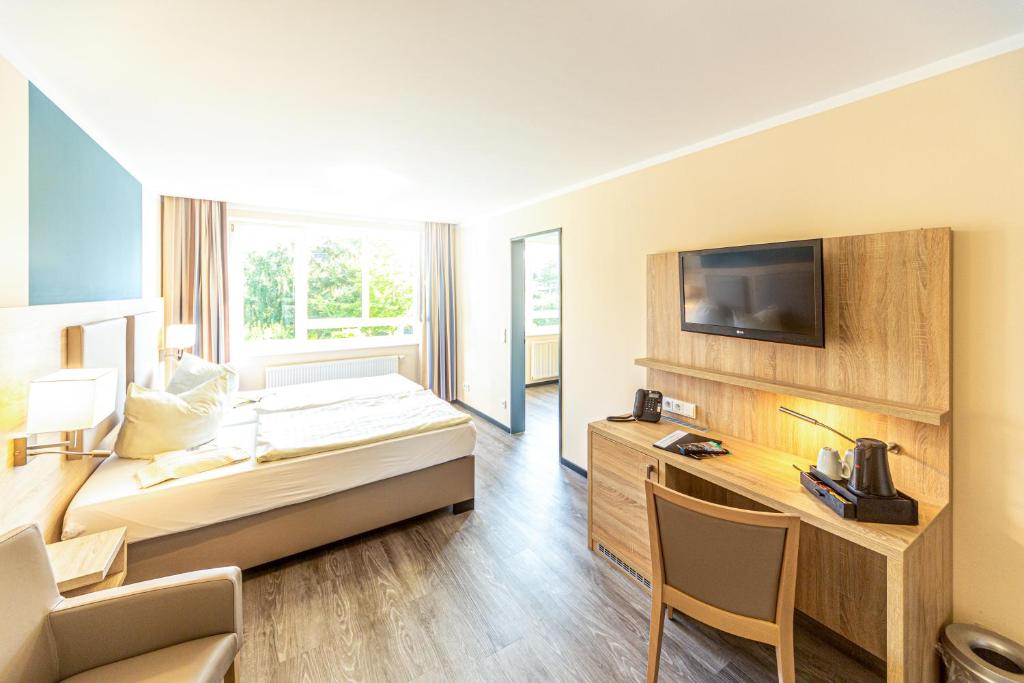 Postel nebo postele na pokoji v ubytování Hotel Rügenblick