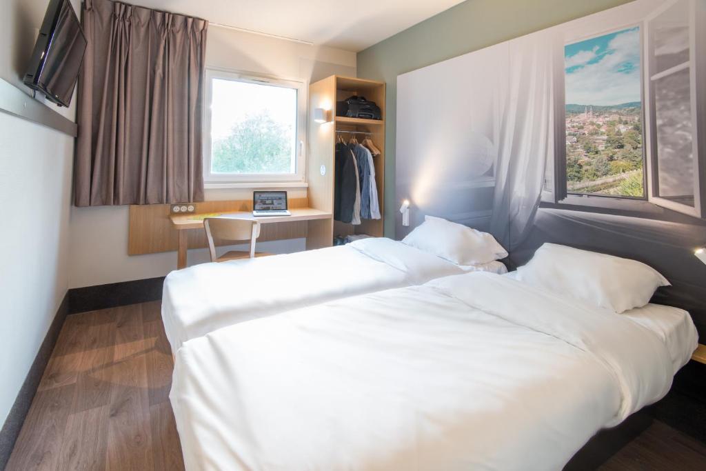 Postel nebo postele na pokoji v ubytování B&B HOTEL Freyming-Merlebach