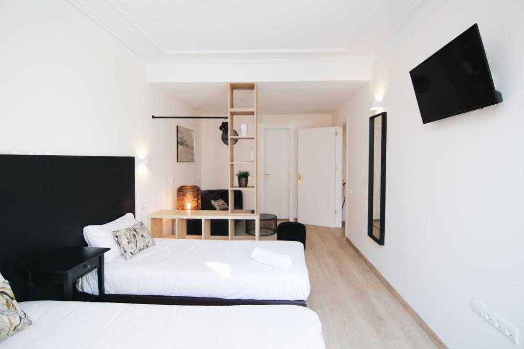 Posteľ alebo postele v izbe v ubytovaní HA Balmes Terrace Apartments