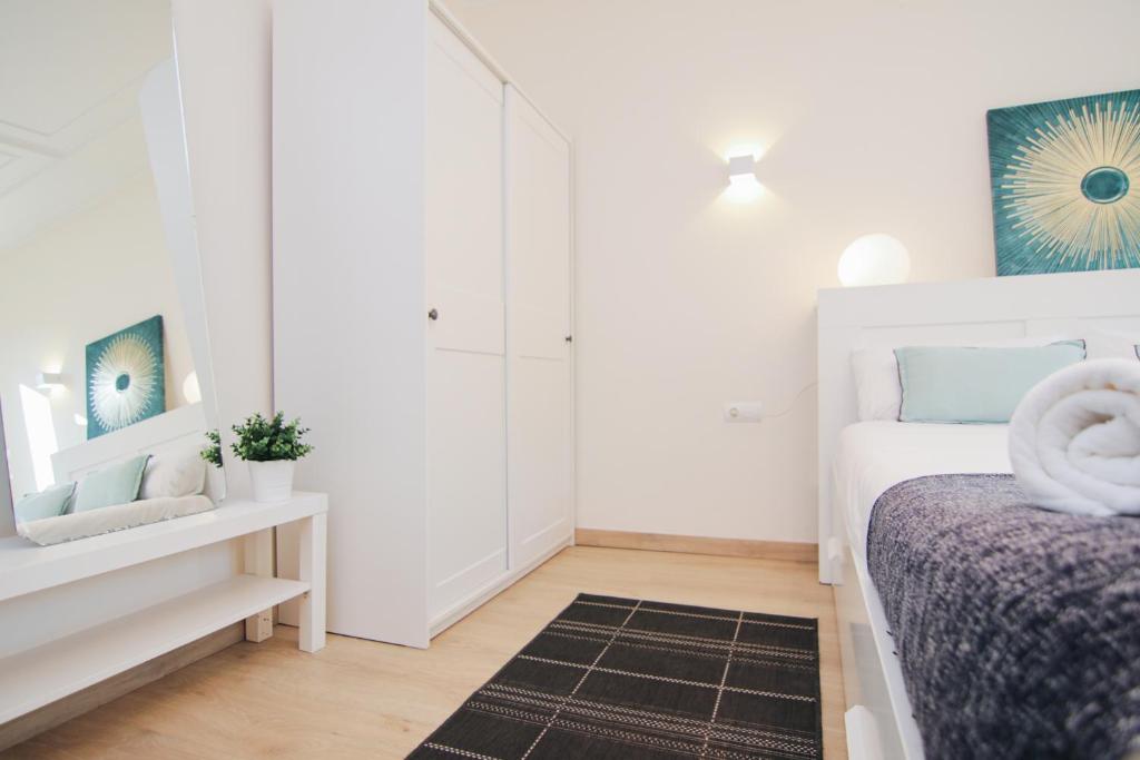 Posteľ alebo postele v izbe v ubytovaní HA Balmes Terrace Apartments