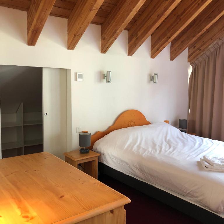 Postel nebo postele na pokoji v ubytování SUNWEB - Timberlodge