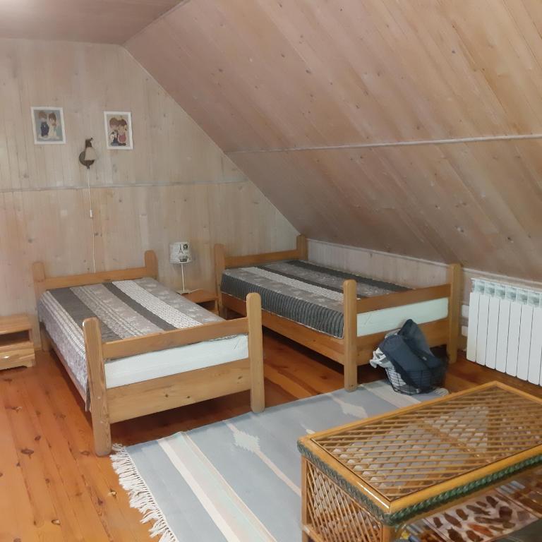 Posteľ alebo postele v izbe v ubytovaní Pod Dębem