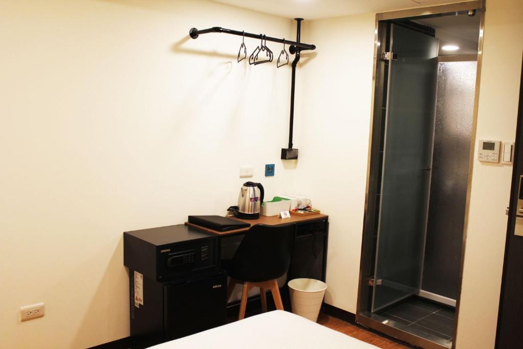 Postel nebo postele na pokoji v ubytování 悦心旅Yesing Hotel