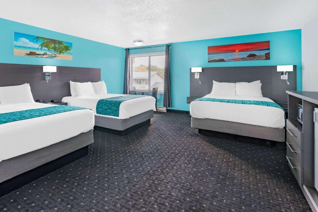 Ένα ή περισσότερα κρεβάτια σε δωμάτιο στο Howard Johnson by Wyndham Gananoque