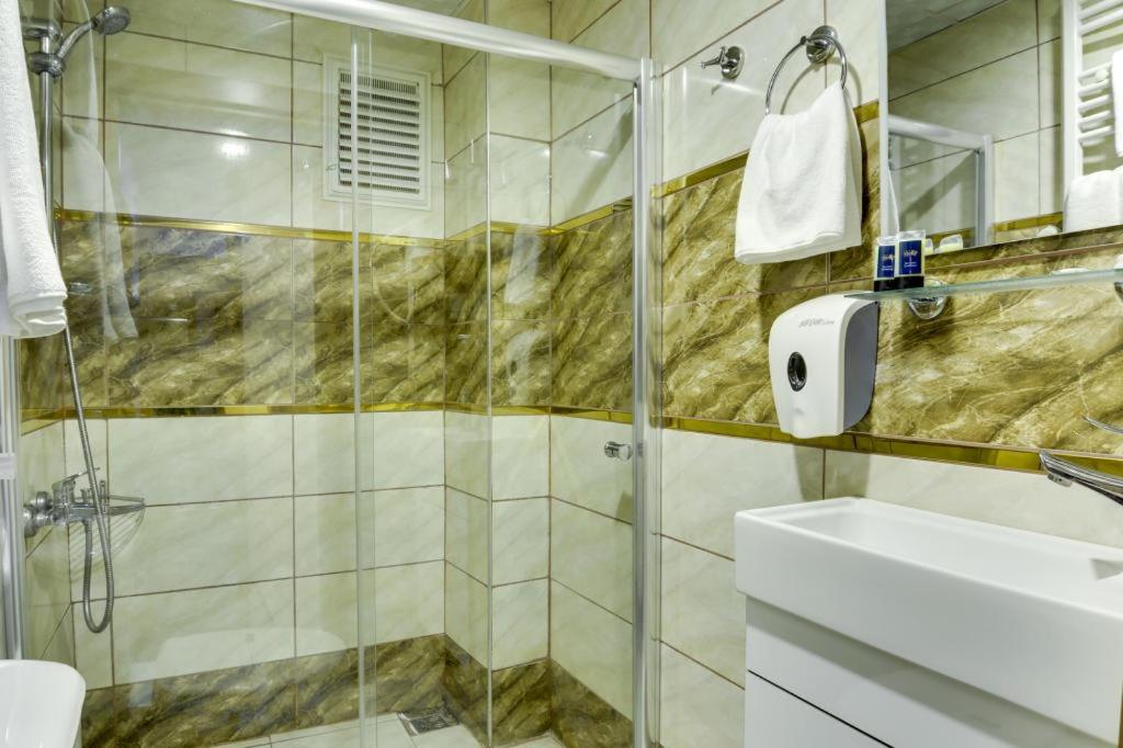 A bathroom at Grande Stella Hotel