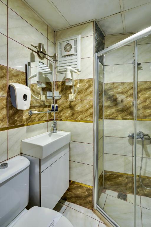 A bathroom at Grande Stella Hotel