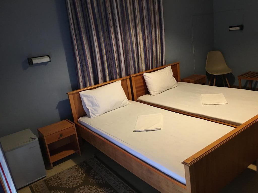 A bed or beds in a room at Artemis